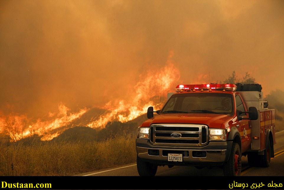 Authorities say almost 1,700 firefighters who are being hindered by scorching temperatures of up to 112 degrees are battling the blaze in the mountains north of Los Angeles known as the Sand Fire