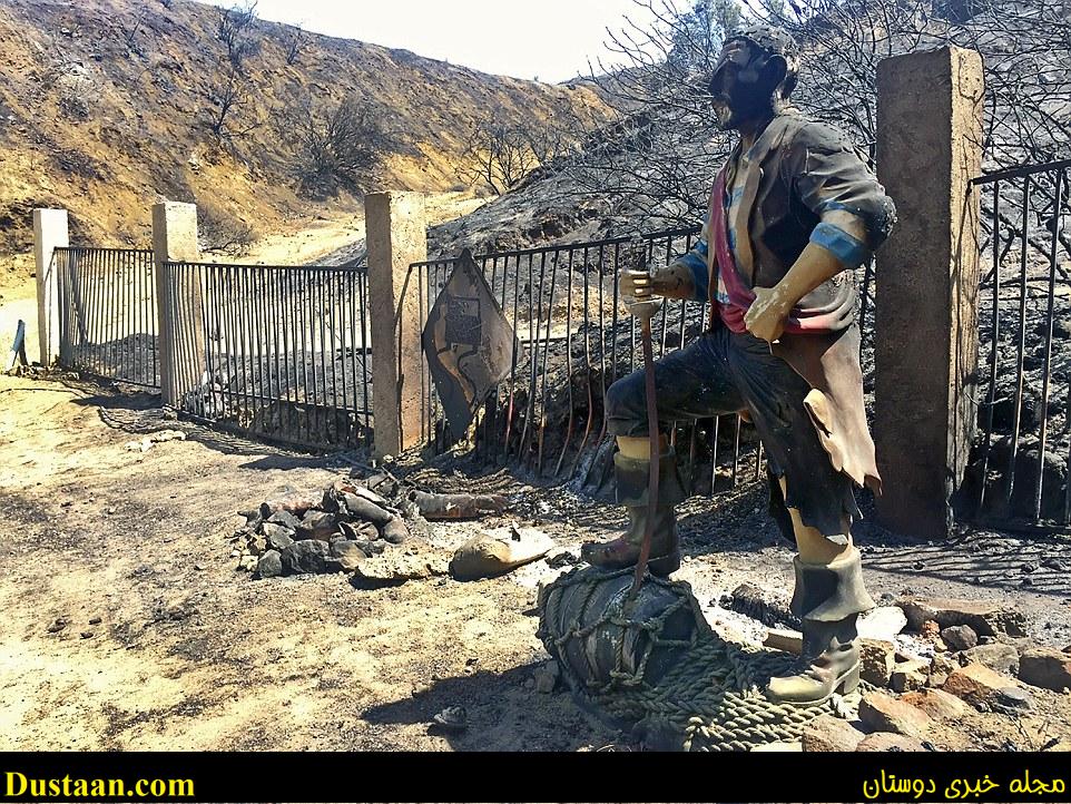 A burned pirate sculpture stands at the end of Iron Canyon Road off of Sand Canyon in Santa Clarita on Sunday