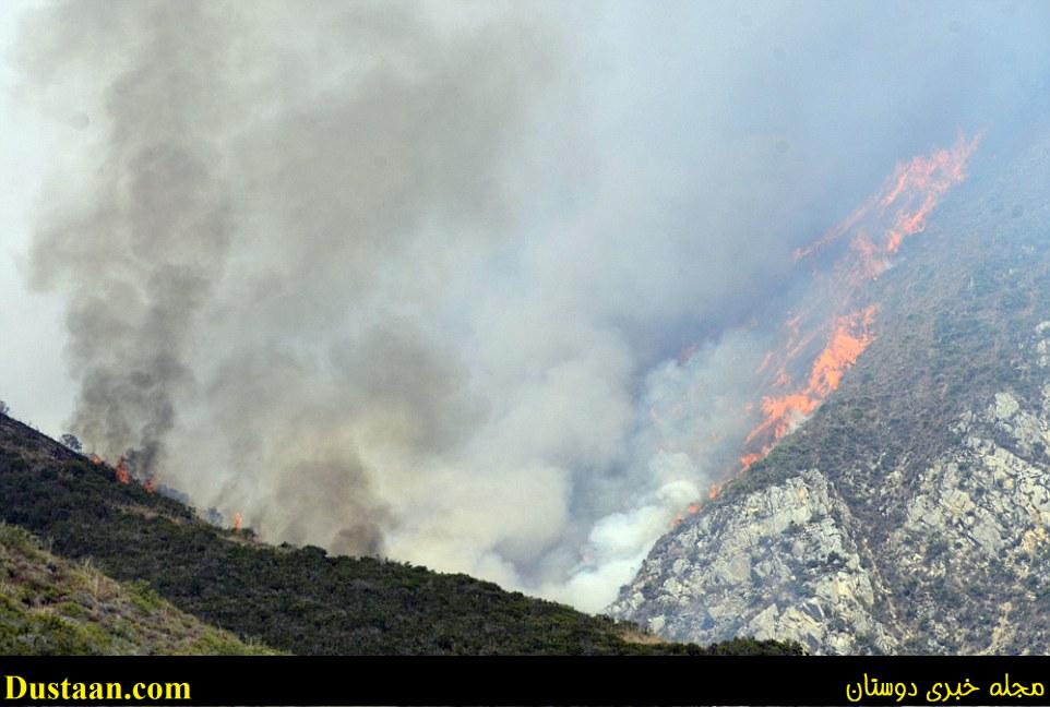 Highway 1 and businesses in the Big Sur area, a major summer tourist destination, remained open on Saturday, despite the wildfire in the mountains (above)