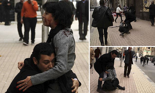 SPAP activist Sabbagh receives help after she was shot during a protest by the party in Cairo