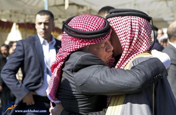 Jordan's King Abdullah offers his condolences to Safi al-Kasaesbeh, the father of Jordanian pilot Muath al-Kasaesbeh, at the headquarters of the family's clan in the city of Karak