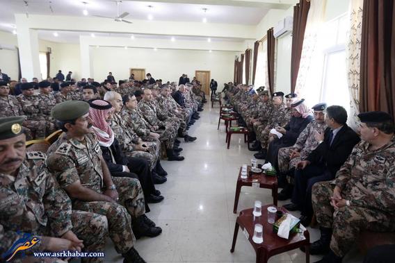 The father of Jordanian pilot Kasaesbeh sits among senior officers of the Jordanian army at the headquarters of his family's clan in Karak