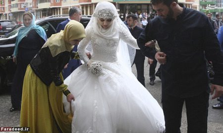 تصاویر/ ازدواج زوری دختر ۱۷ ساله با رئیس پلیس! A bride, Chechen Kheda Goilabiyeva, is taken by head of the Chechen leader's administration Magomed Daudov to a wedding registry office for her wedding with Chechen police officer Nazhud Guchigov, in Chechnya's provincial capital Grozny, Russia, Saturday, May 16, 2015. A 46-year-old Chechen police officer taking a 17-year-old as his second wife in flagrant violation of Russian laws has caused a storm in the Russian media and put the regions ruler on the defensive. (AP Photo)