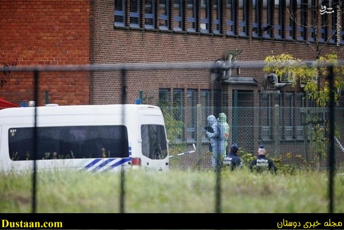 Forensics enter the National Institute for Criminalistics and Criminology (INCC-NICC) to inspect the site of an explosion that happened early on August 29, 2016, in Neder-Over-Heembeek. An explosion at a criminology institute in Brussels, early on August 29, 2016, has caused major damage but no casualties, prosecutors and the fire service said. A car broke through three fences and was detonated close to the institute's laboratories causing a violent fire, according to Belgian medias. / AFP / Belga / THIERRY ROGE / Belgium OUT        (Photo credit should read THIERRY ROGE/AFP/Getty Images)