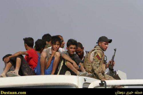 Displaced Iraqis from Qayyara sit in a vehicle belonging to Iraqi security forces, as they transfer to Tikrit, in Qayyara, Iraq, August 29, 2016. REUTERS/Azad Lashkari