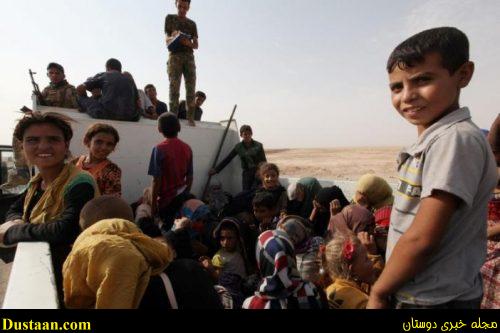 Iraqi displaced from Qayyara sit in a vehicle of Iraqi security forces to transfer to Tikrit, in Qayyara, Iraq, August 29, 2016. . REUTERS/Azad Lashkari
