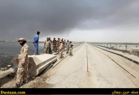 Iraqi army gather on a floating bridge on the outskirts of Qayyara, Iraq August 29, 2016. REUTERS/Azad Lashkari