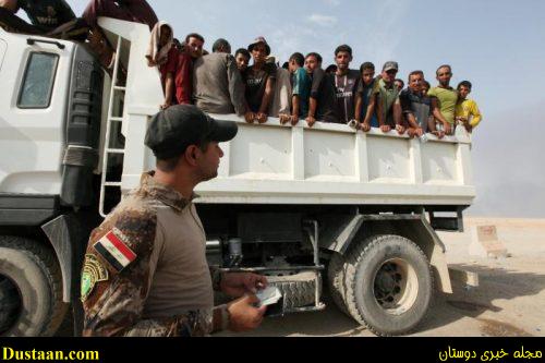 Iraqi displaced from Qayyara sit in a vehicle of Iraqi security forces to transfer to Tikrit, in Qayyara, Iraq, August 29, 2016. REUTERS/Azad Lashkari