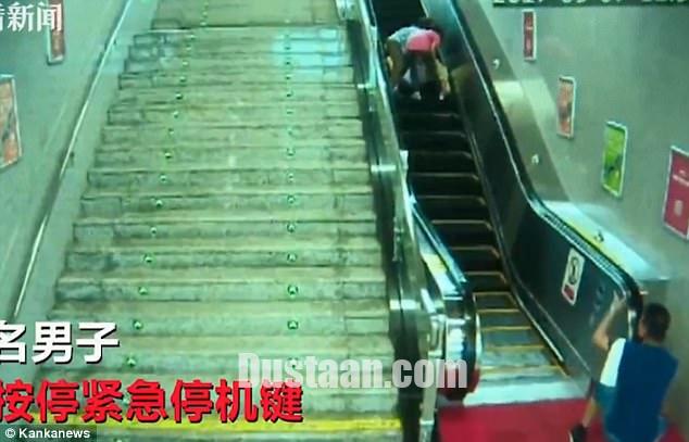 www.dustaan.com-گیر کردن سَر مرد چینی در پله برقی! +تصاویر
