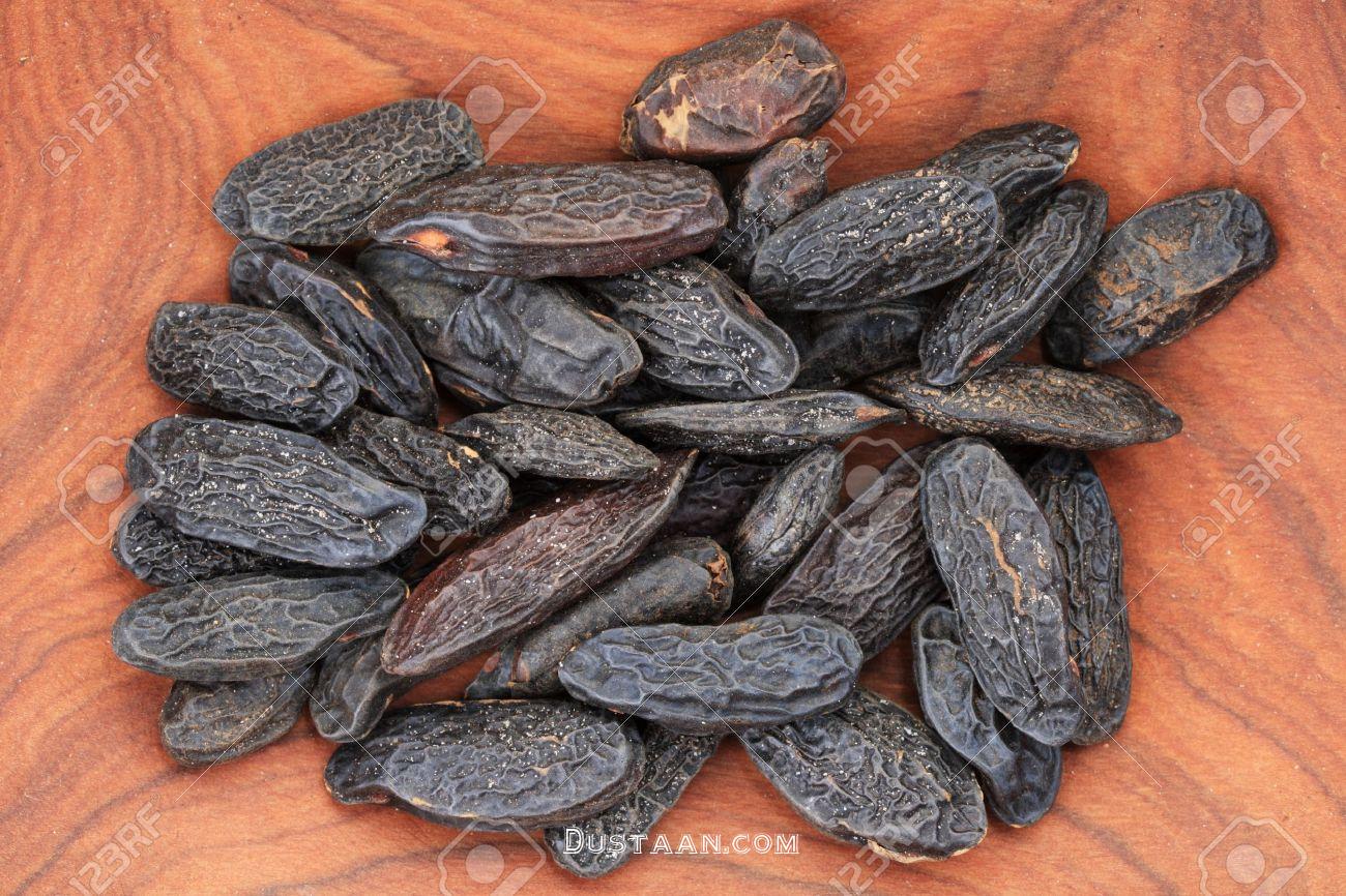 https://previews.123rf.com/images/pancaketom/pancaketom1109/pancaketom110900036/10597563-tonka-beans-Dipteryx-odorata-on-wood-background-Stock-Photo.jpg